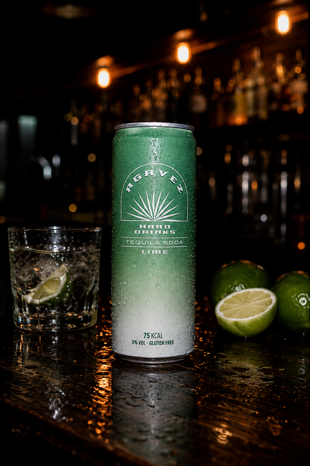 Agavez Tequila Soda Lime can on a dark bar top with limes
